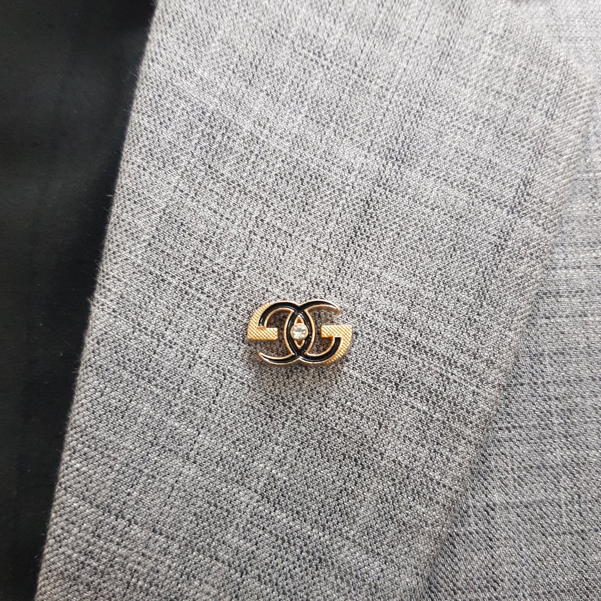 Golden Interlock Crest Lapel Pin